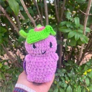 Handmade crochet turtle with a lily pad on its head